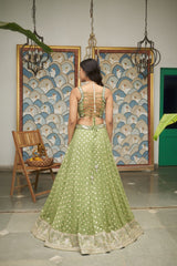 Green Net Sweetheart Neck Embellished And Woven Lehenga Set